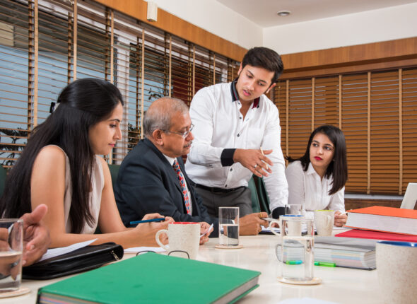 Asian Indian Business People or Corporate culture and Working in the office Concept with Laptop, papers, meetings, presentations and discussions